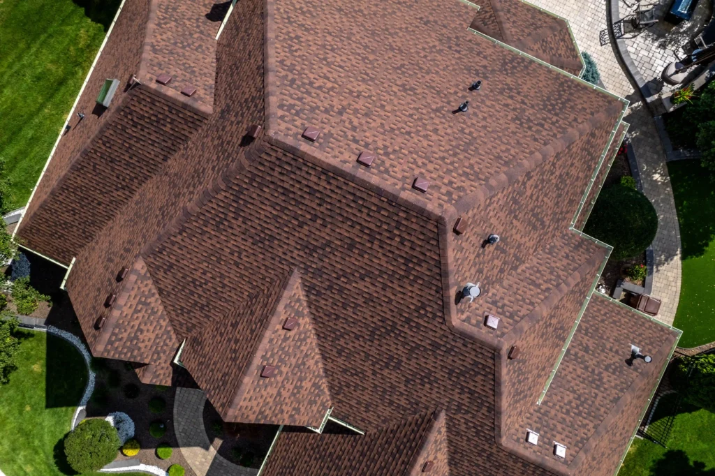 Aerial view of a hail-damaged roof repaired by Clearway Exteriors